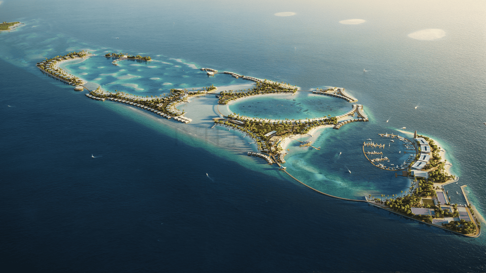 Aerial view of overwater villas and marina in a stunning tropical resort, perfect for luxury real estate investment.
