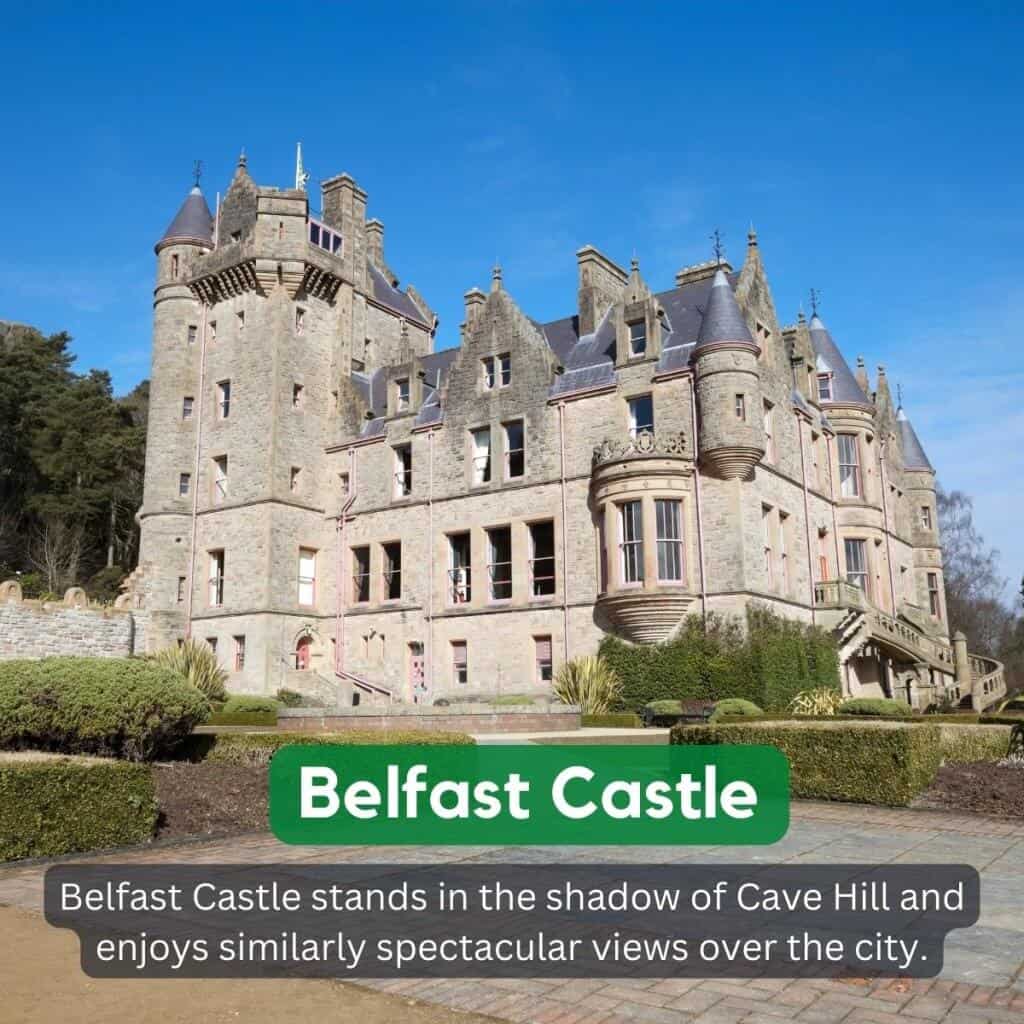 Belfast Castle with Gothic architecture in Belfast, Ireland, under a clear blue sky.
