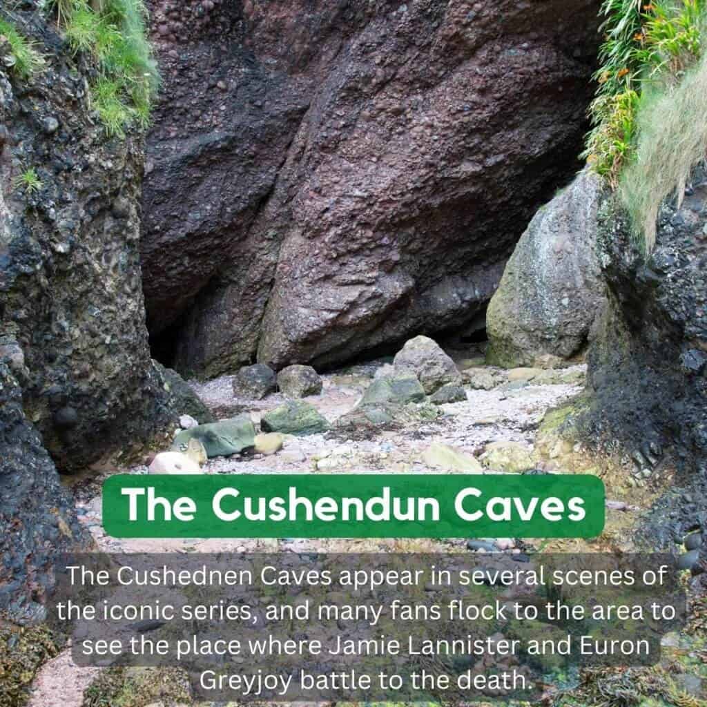 Cushendun Caves in Ireland nestled among rocky cliffs and lush greenery.