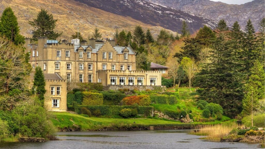 Elegant Irish mansion surrounded by lush gardens and iconic nature views.