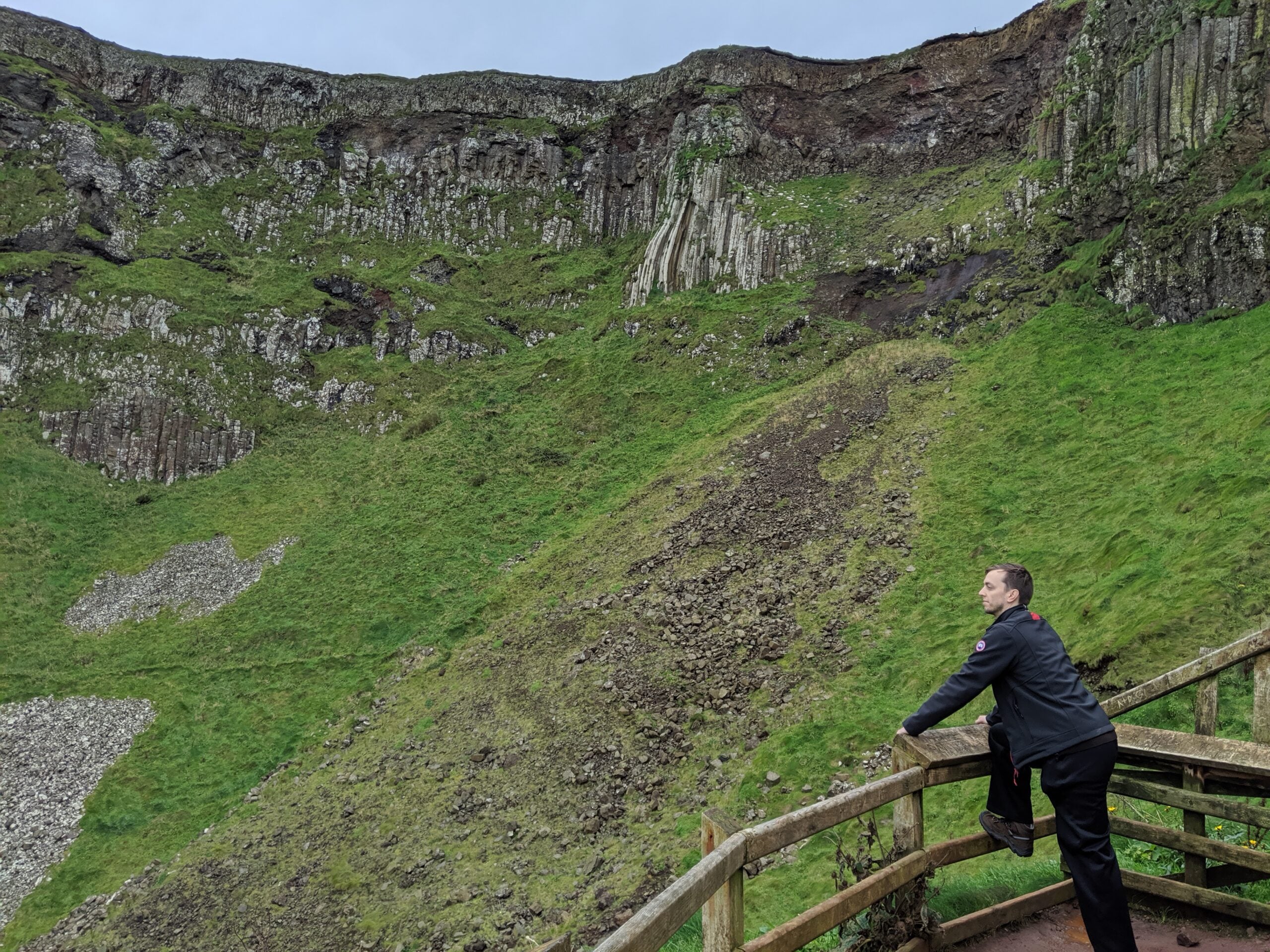 Man overlooking Cliffs of Moher in County Clare, Ireland.
