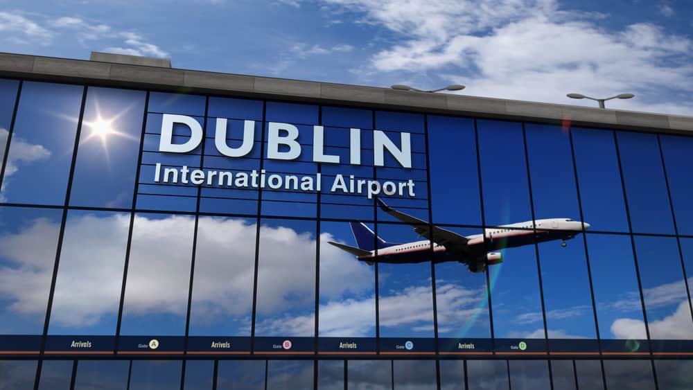 Dublin Airport terminal with airplane model on glass facade.