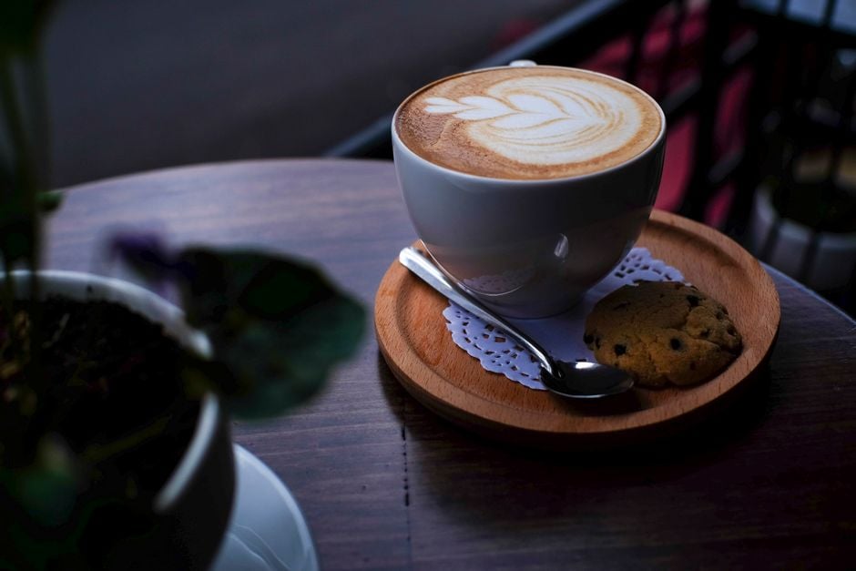 Coffee latte with foam art in Galway cafe, Ireland.