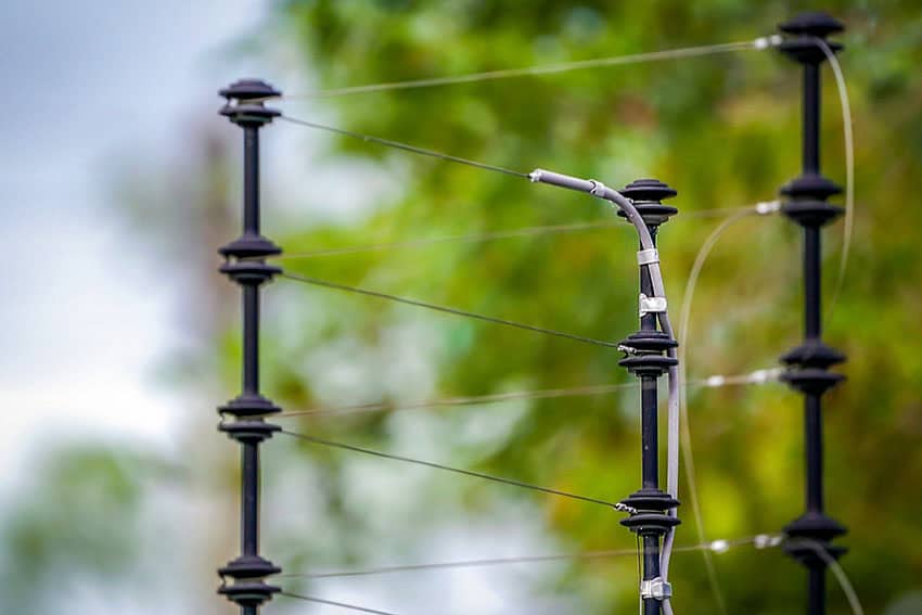High-voltage electric fencing to protect your property from intruders and enhance security.