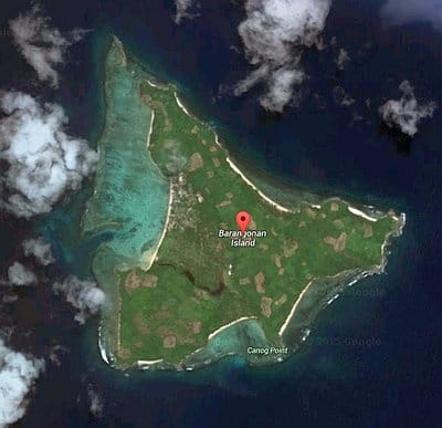 A satellite view reveals Barangonan Island, a small triangular gem amidst the blue ocean and white clouds. Ideal for island hopping or a boat tour, it promises serene exploration.