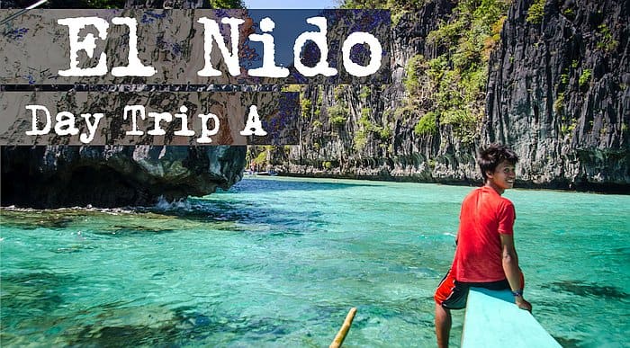 Person in a red shirt sitting on a boat, navigating clear turquoise waters surrounded by rocky cliffs. Text: "El Nido Day Trip A – the ultimate boat tour adventure.