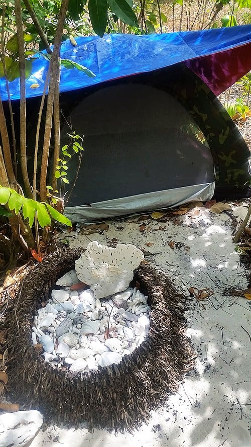 Camping on Dimancal Island F Spot entrance area to tent adorned with local corals