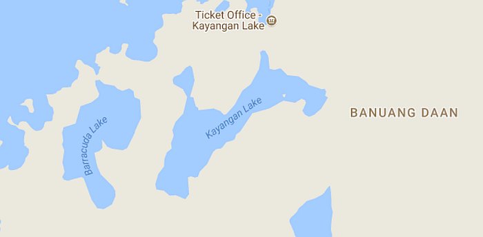 Map illustrating the stunning Coron area in Palawan, highlighting Kayangan Lake and Barracuda Lake in Banuang Daan. The map features water bodies encircled by land, with a marked spot for the Kayangan Lake ticket office.