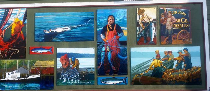 A collage of murals depicting fishing scenes, including a person with fishing gear, boats on the water, and historical imagery of fishermen at work. Bright colors highlight the vibrancy of the aquatic setting, inviting you to make this part of your road trip tour experience.