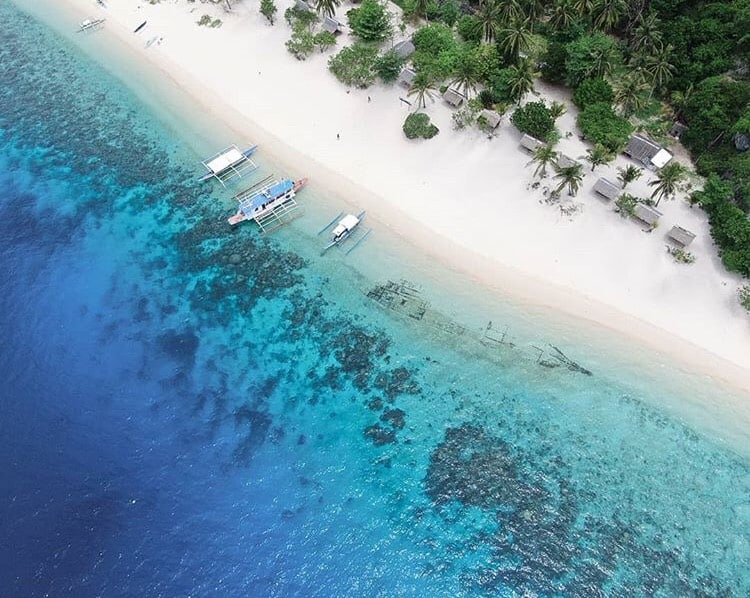 Clear waters away from the crowds on Exploring Caves and Shipwrecks in Black Island, Coron.