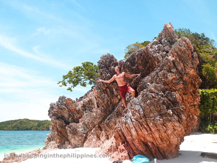 Boat tours itinerary between El Nido and Coron malcapuya island big rock formation 4033