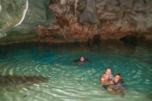 Lounging in the water of a cave in Black Island, Coron, Philippines