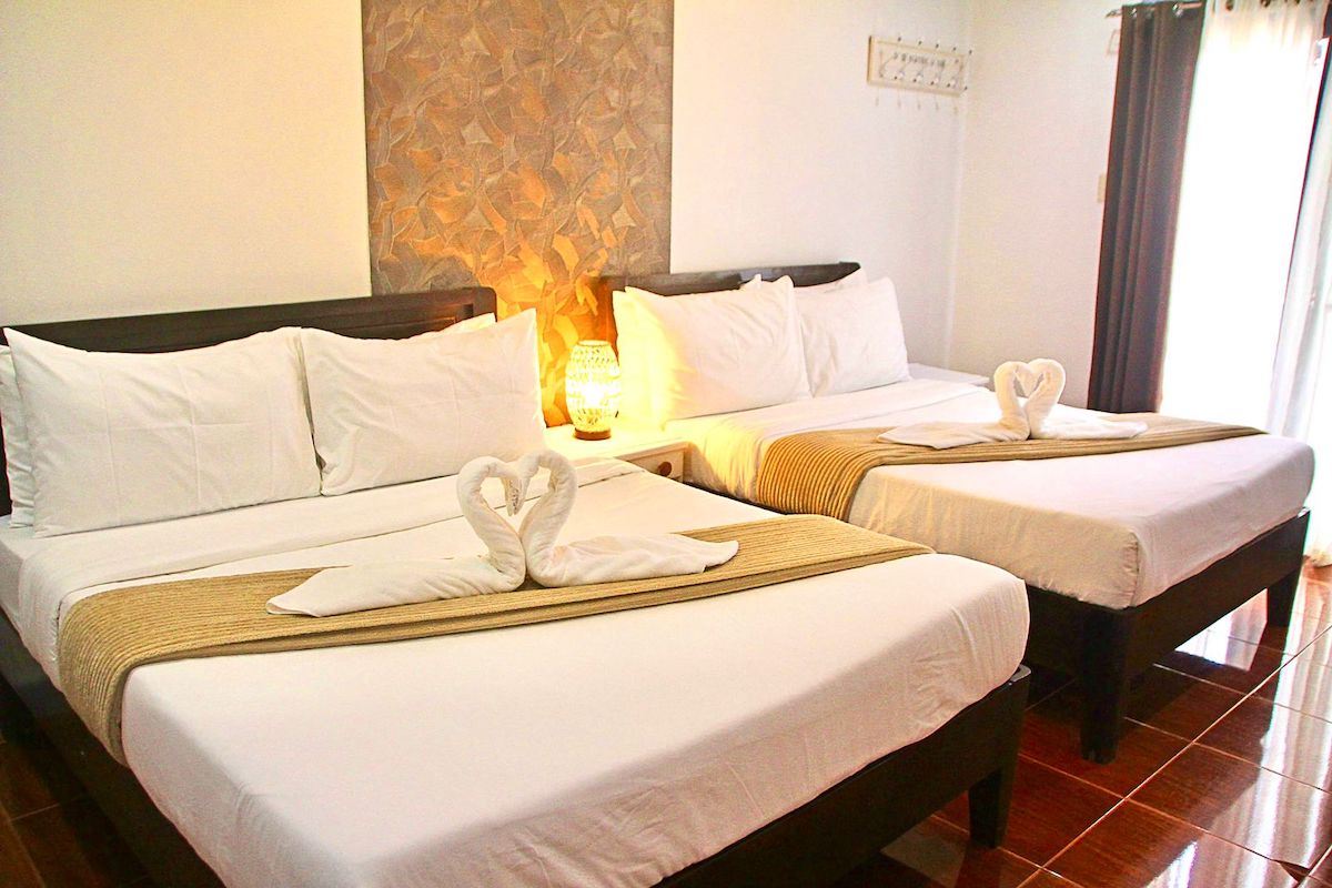 2 beds of El NIdo hotel 1, island hopping tours