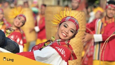 Dancers in colorful traditional costumes perform joyfully at a cultural festival, featuring vibrant red and yellow attire. Nearby, visitors enjoy an island hopping adventure, adding to the festive atmosphere with glimpses of the local culture from each unique stop.