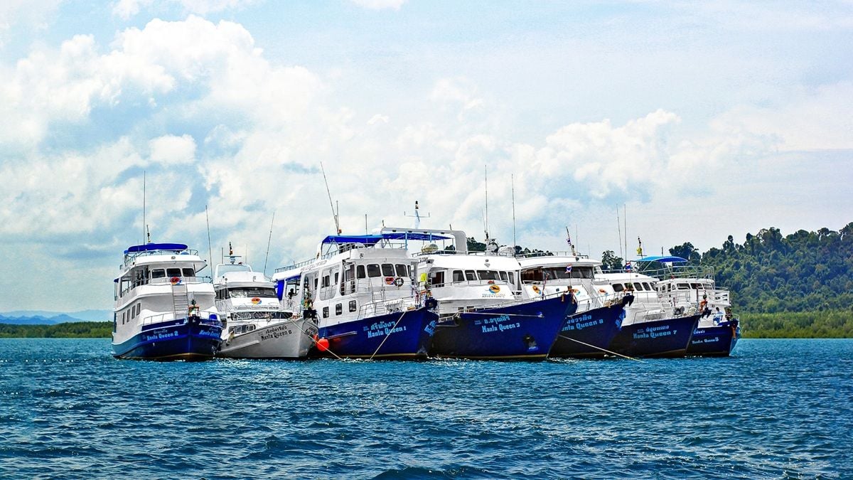 Manta Queen fleet of boats docked in the water in Thailand.