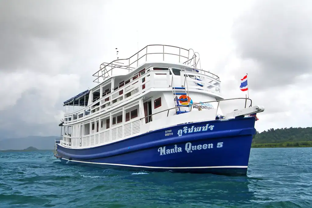 Manta Queen 5 cruise ship in Thai waters with flag flying.