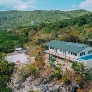 A cozy villa overlooking the lush Philippine landscape and river. Perfect for a relaxing getaway.