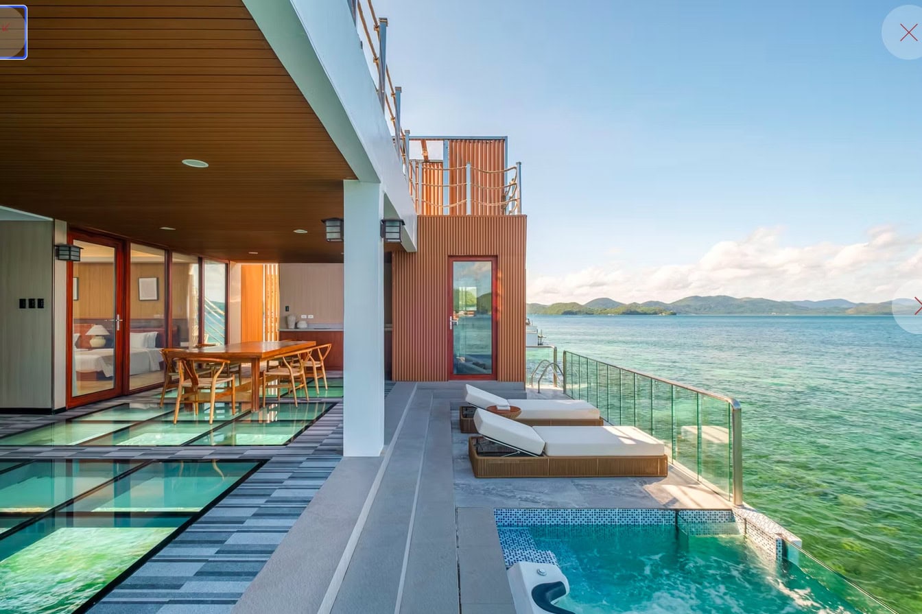 Stunning beachfront view from a modern island resort in the Philippines with a private pool and ocean access.