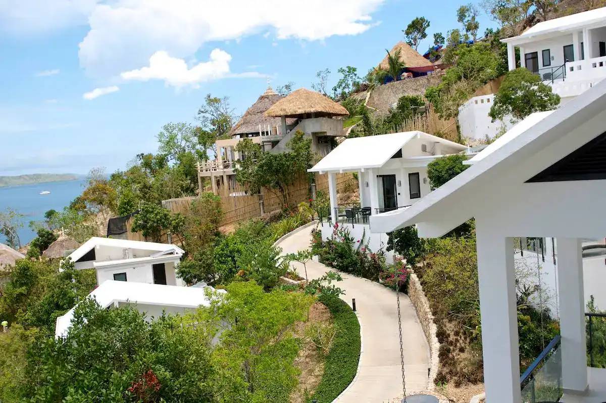 Beautiful hillside villas with modern architecture overlooking the sea in the Philippines.