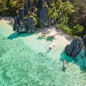 Pristine white sands and clear turquoise waters in the Philippines’ stunning islands.