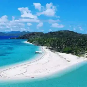 Stunning white sandy beaches with clear turquoise waters in the Philippines.