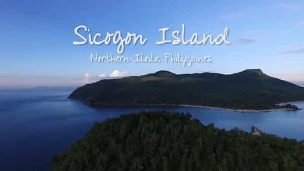 Aerial view of Sicogon Island, Northern Iloilo, Philippines, ideal for island hopping with lush greenery and clear blue waters under a sunny sky.