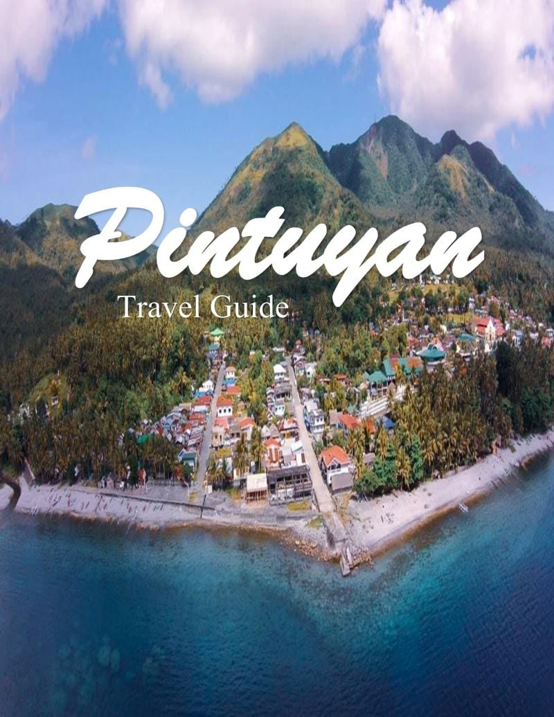 Scenic view of Pintuyan's coastal village with lush mountains in the background, perfect for whale s.