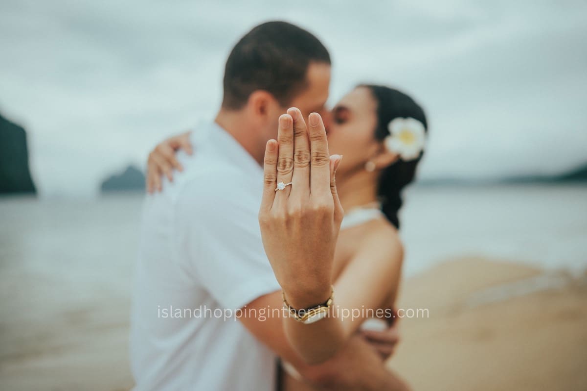 Close-up of an engaged woman showing her wedding ring against a romantic beach setting in the Philippines.