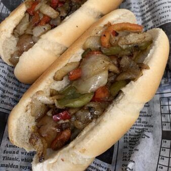 Savory vegetable hoagie with roasted peppers and onions, fresh sub sandwich, delicious lunch option.