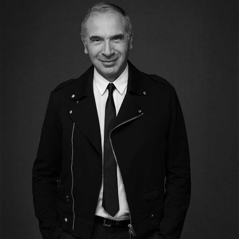 a black and white photo of a man in a suit and tie