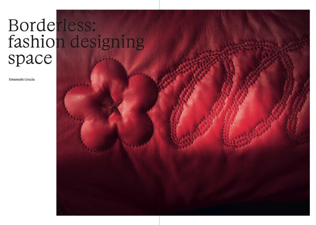 a red leather couch with a flower on it