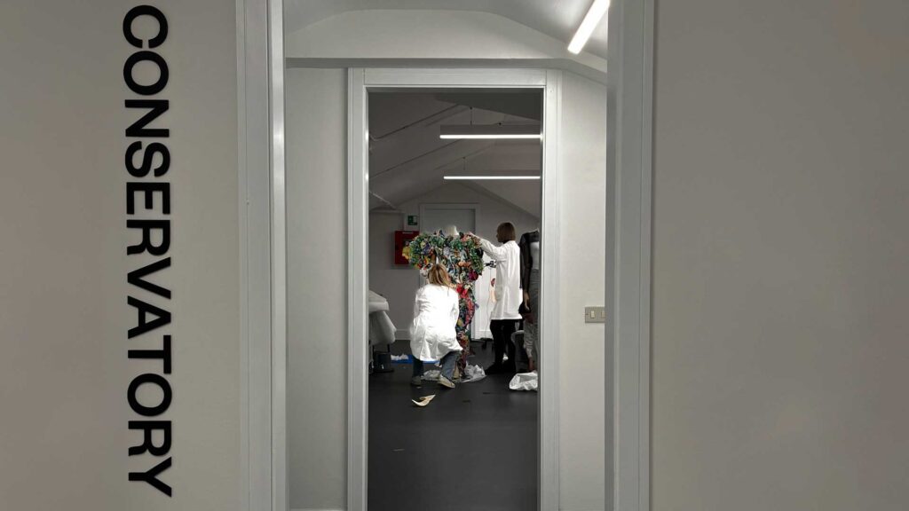 a hallway with a sign on the wall