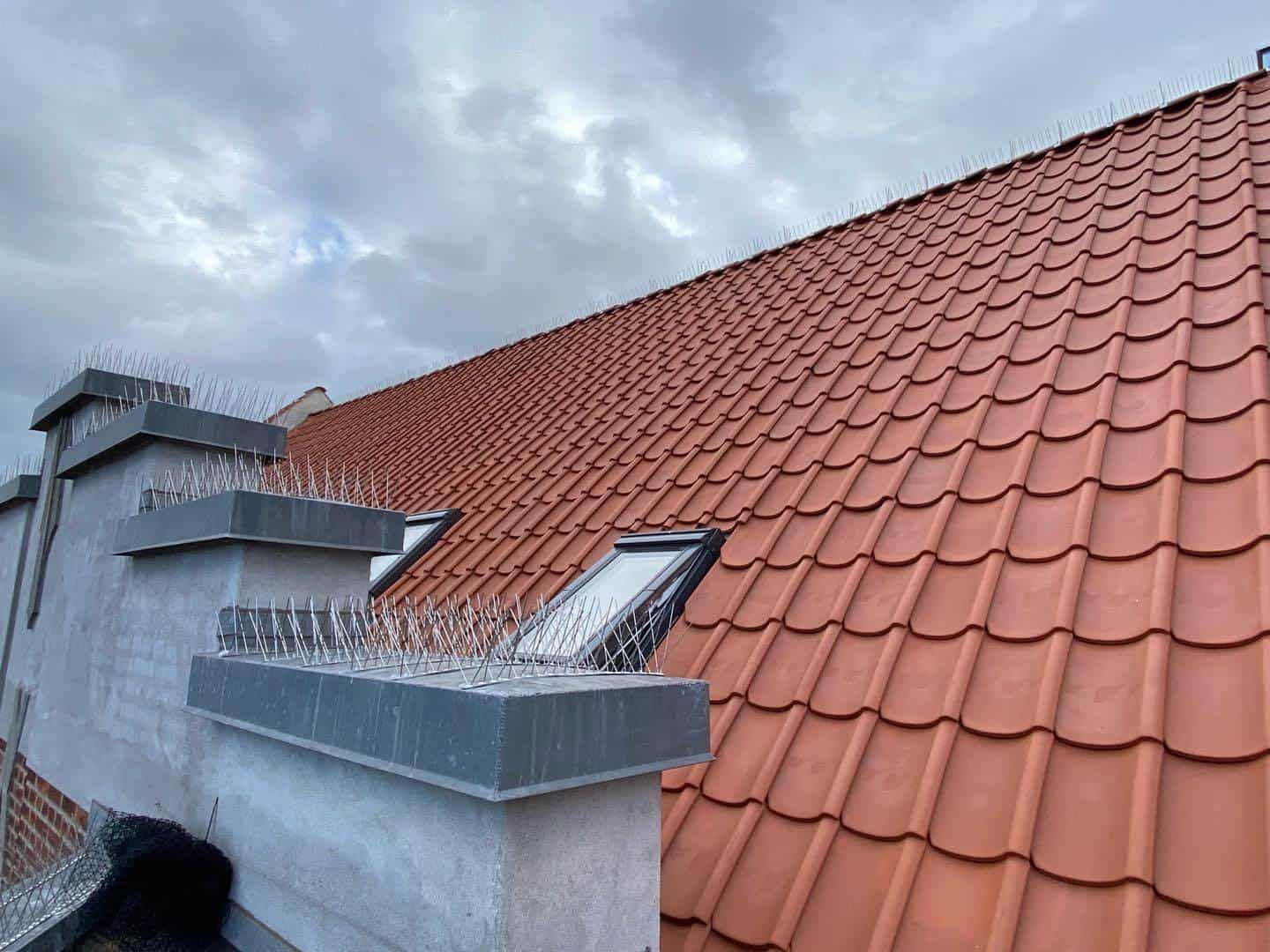 Tagrenovering med nye tagsten og tagvinduer i Aarhus.