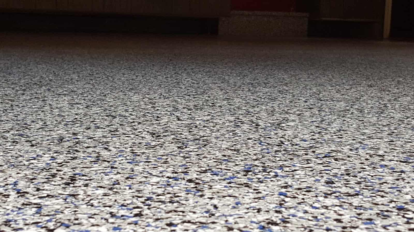 Epoxy floor finished by J&P Coatings, showing a smooth, colorful surface that looks clean and strong.