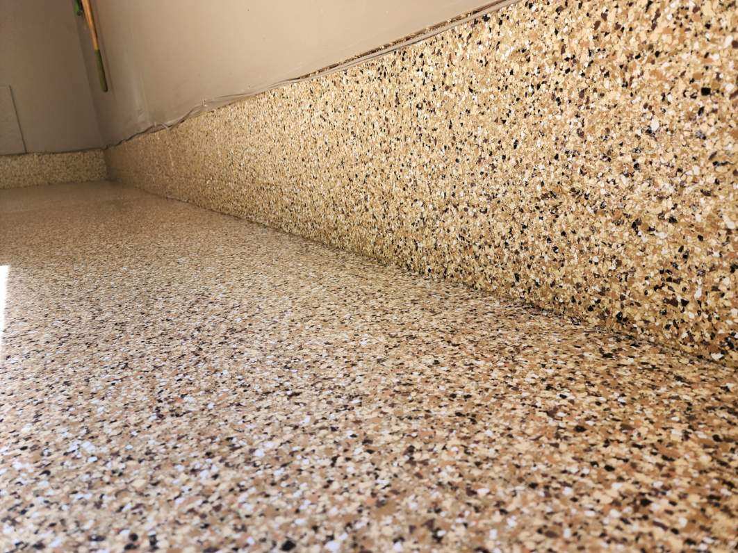 J&P Coatings shows a strong, shiny epoxy floor in neutral colors that looks modern and fits well in basements or busy rooms.