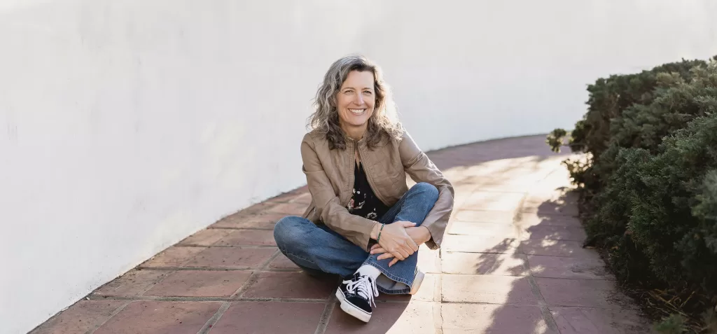 shown seated in tile walkway San Diego photographer Jennifer Dery