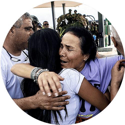 Family after destruction of their home - Oct 2023 - Credit AG