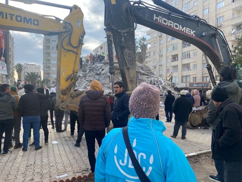 JDC staff assist as cranes remove earthquake debris