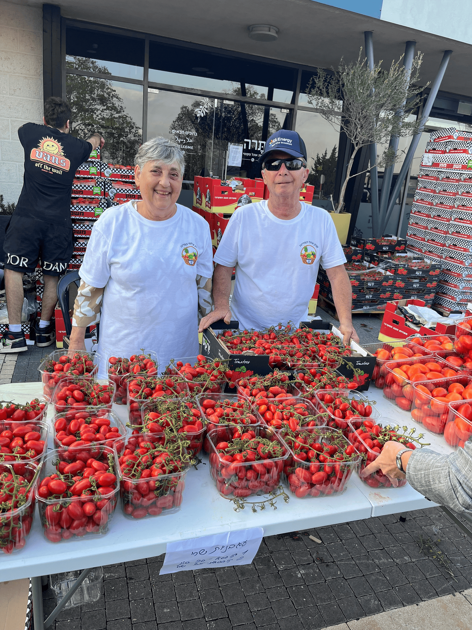 Volunteers selling produce near Gaza.