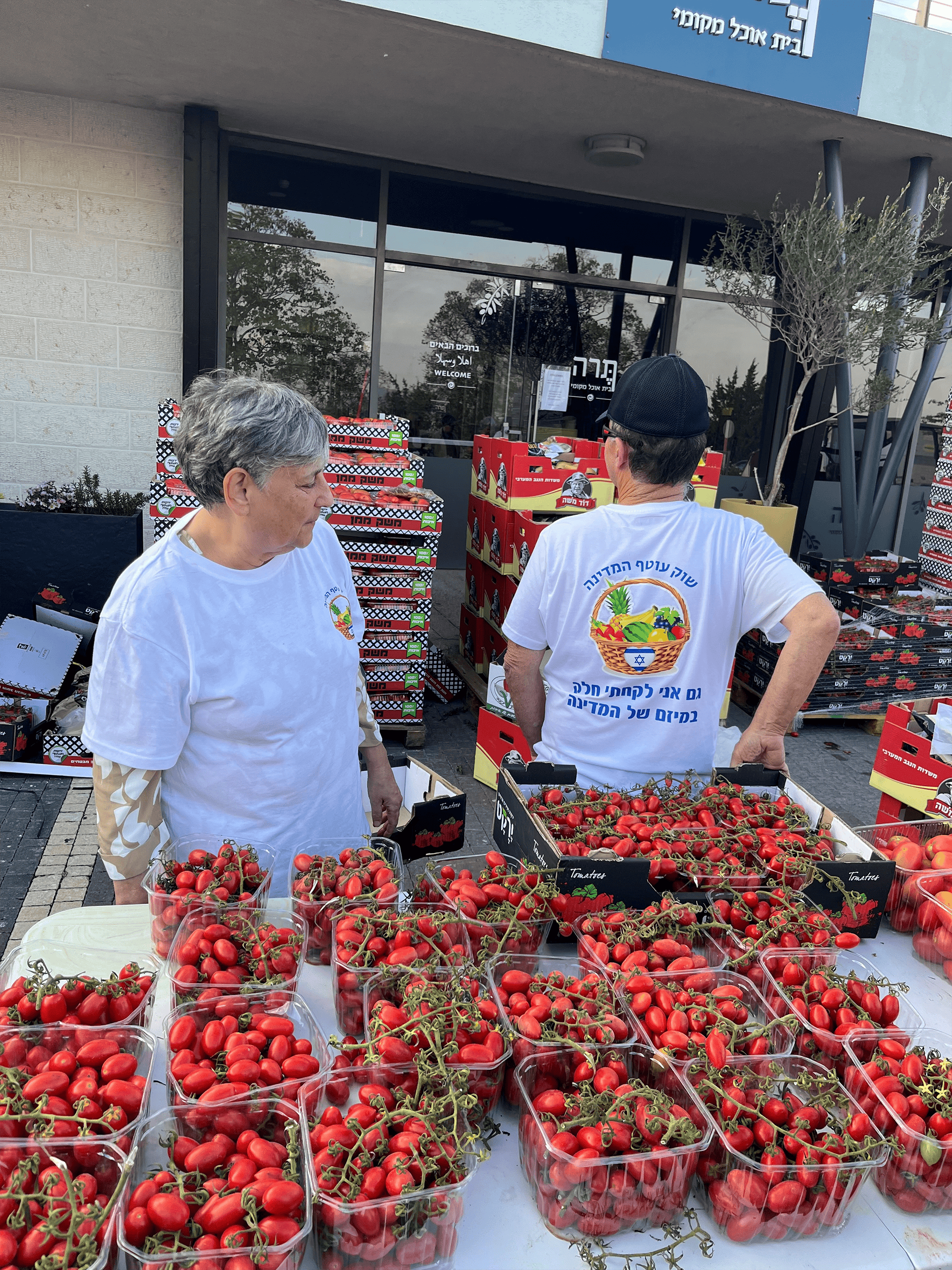 Volunteers selling produce near Gaza.
