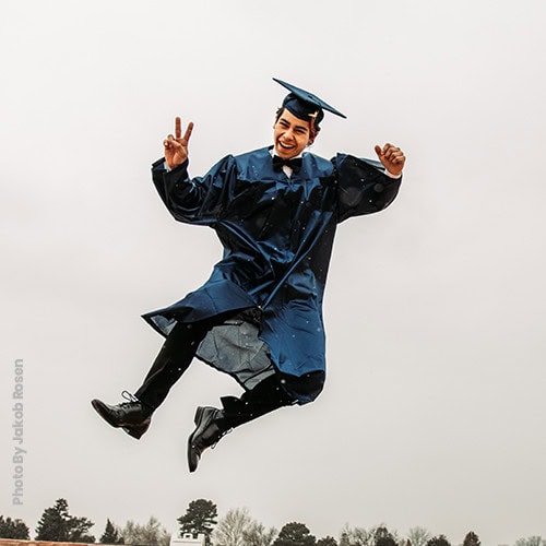 graduate jumping for joy_Photo by Yakob Rosen
