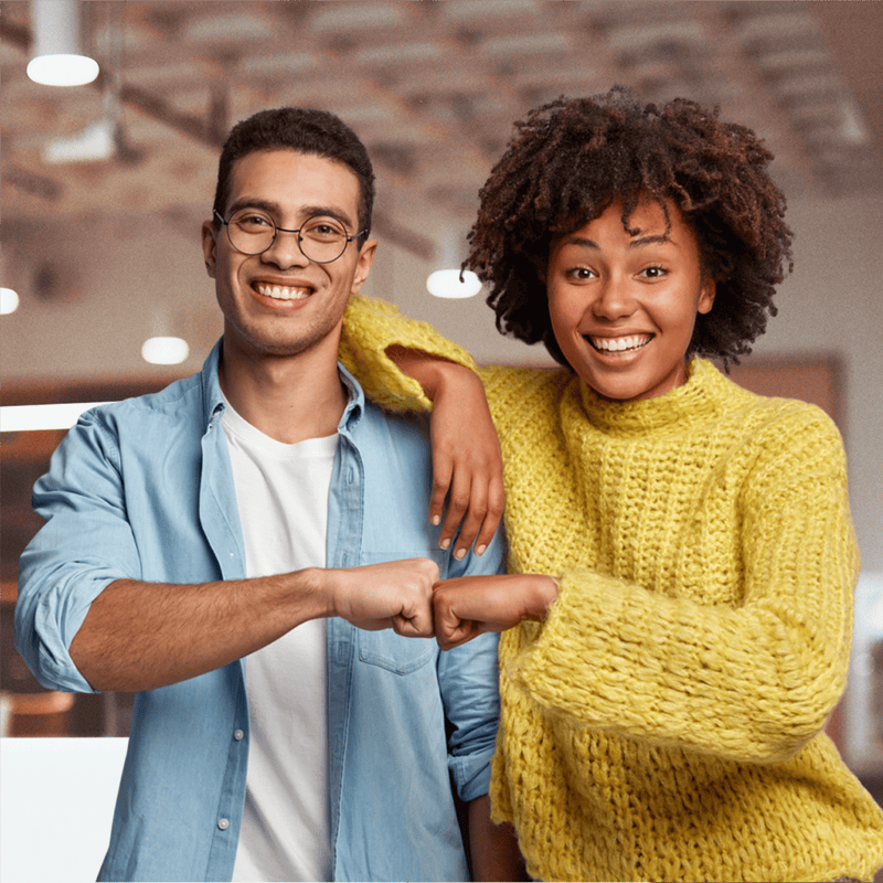 two upstreet teens fist bumping