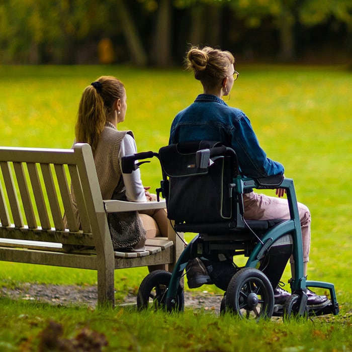 person in wheelchair and health aid