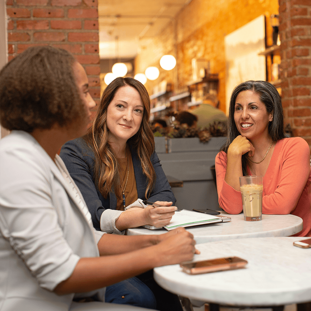 women sharing ideas