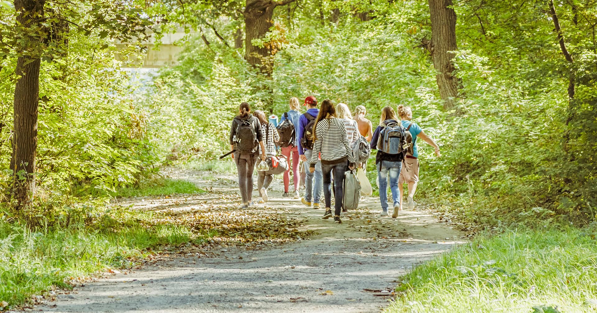 young adults hiking in park