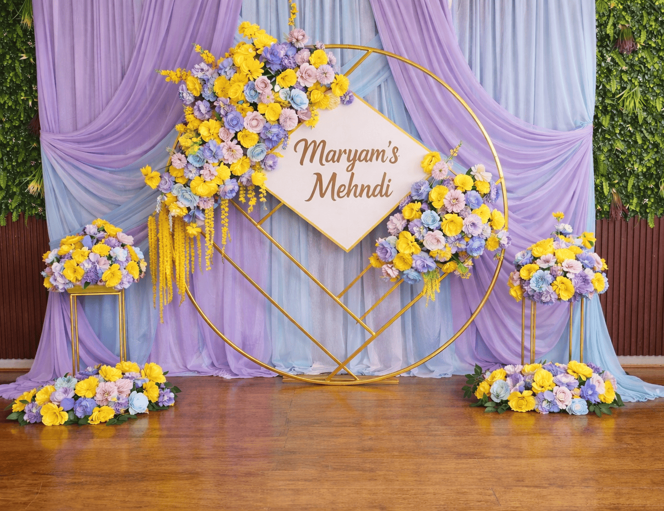 Elegant mehndi event floral decoration with yellow and purple blooms.