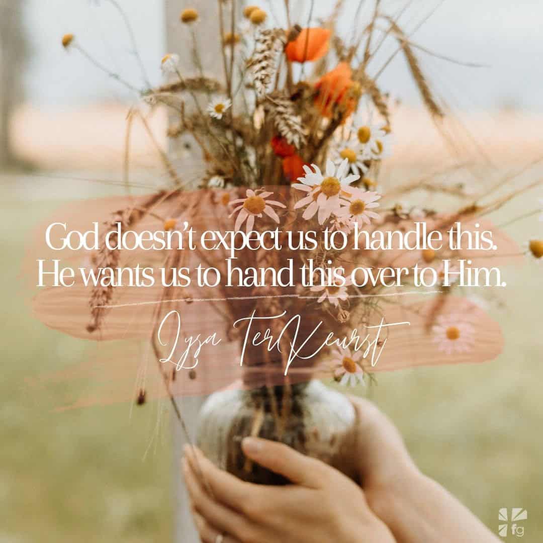 Hand holding a vase with a flower bouquet and an inspirational quote.