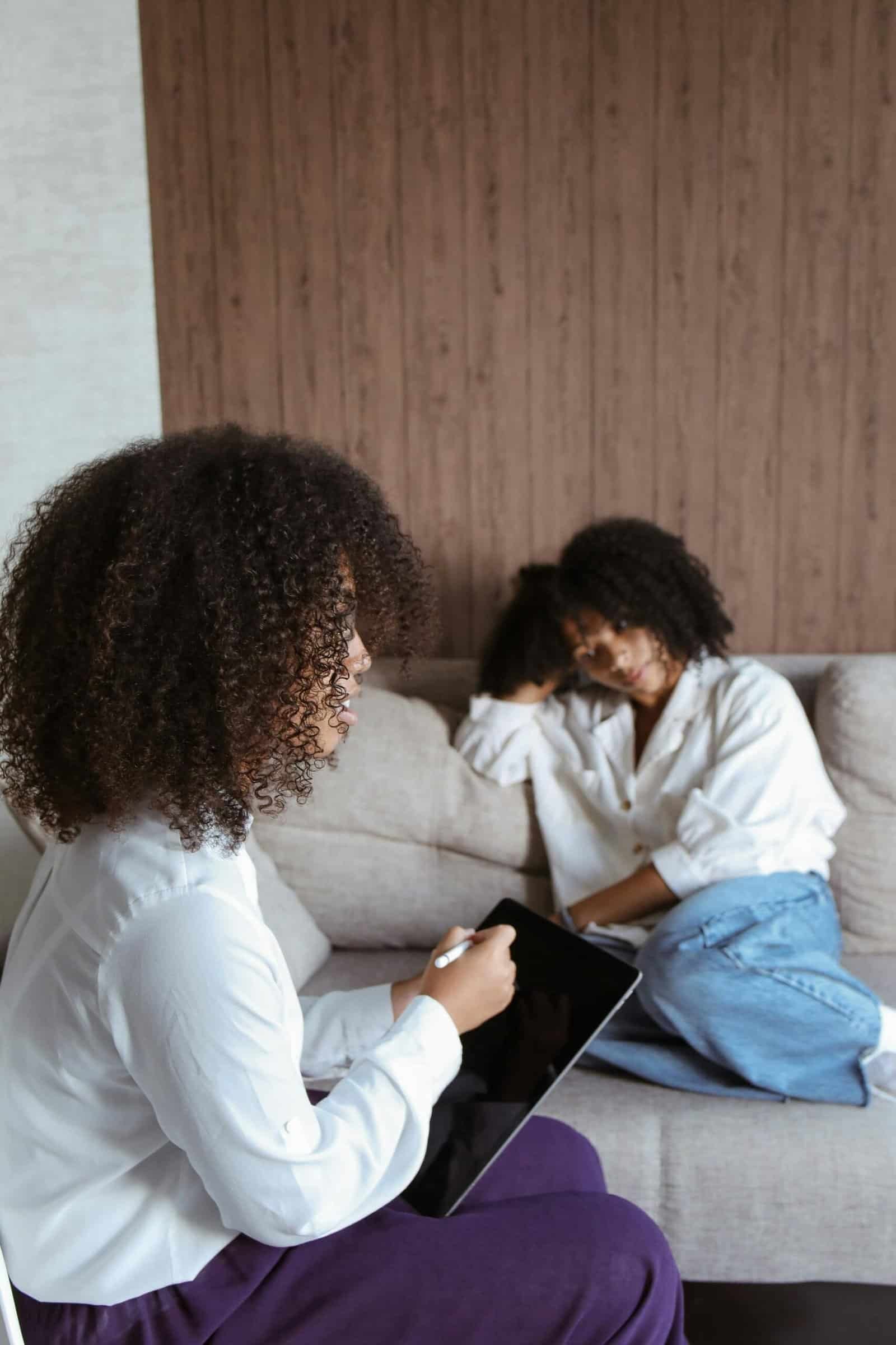 Therapist working with a teen in a therapy session