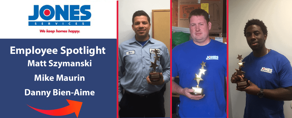 Three men, each holding a star-shaped trophy, stand in front of a sign that reads "Jones Services: We keep homes happy. Employee Spotlight." They are Matt Szymanski, Mike Maurin, and Danny Bien-Aime.