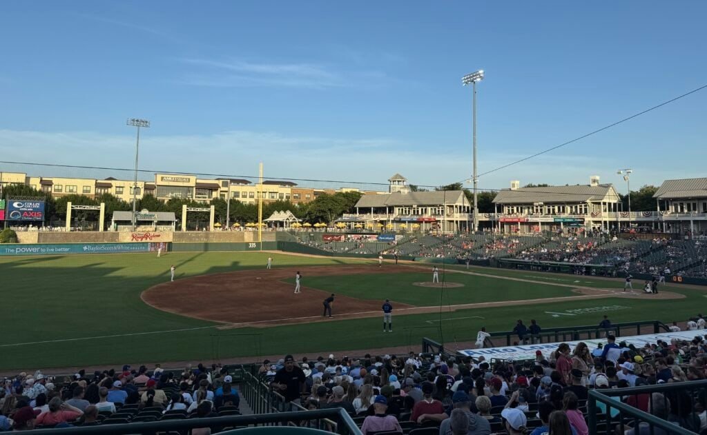 Players on the field during a Frisco RoughRiders game.